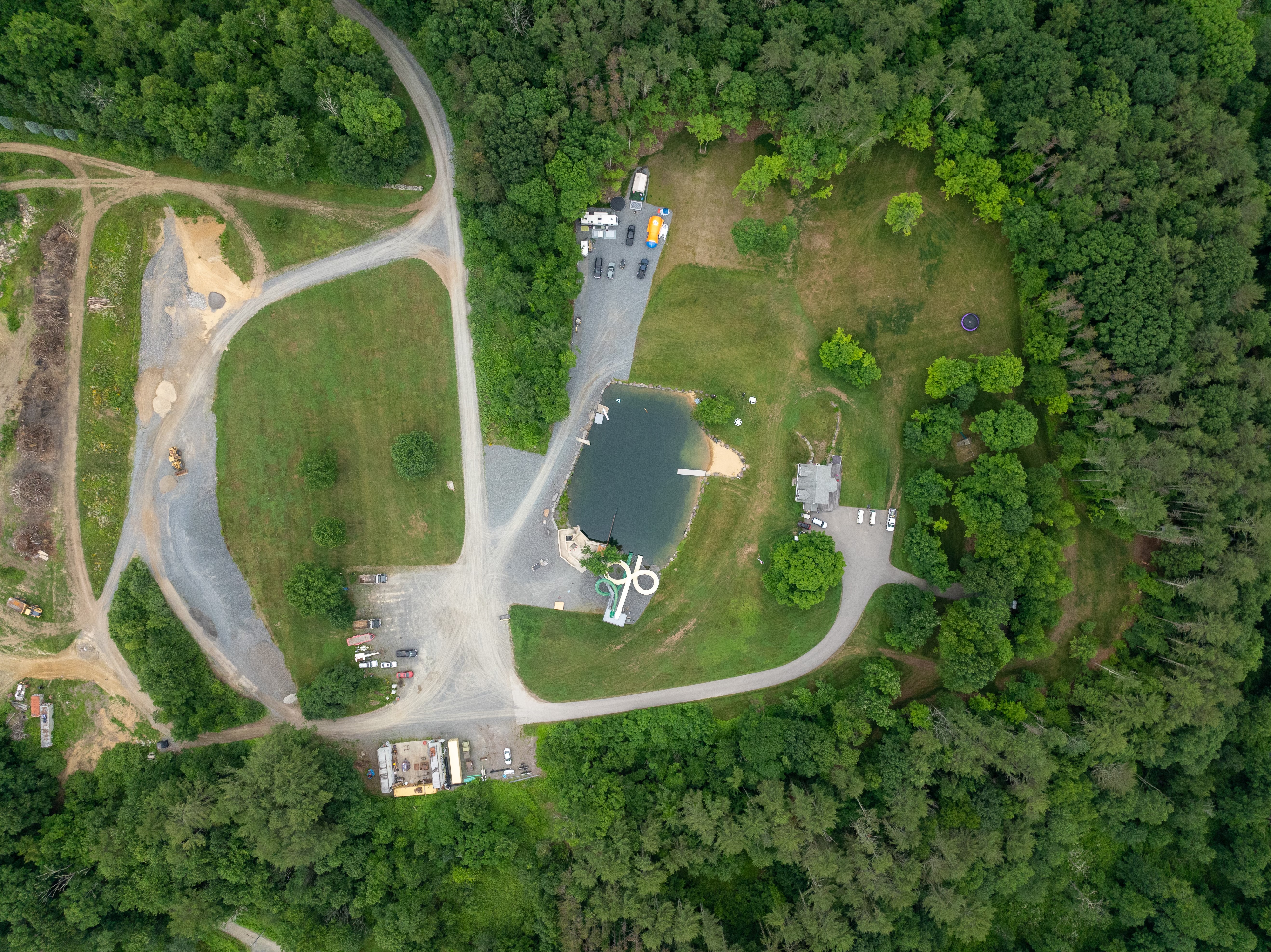 Aerial map of the SenderLand venue — lake, parking lots, trails and grounds